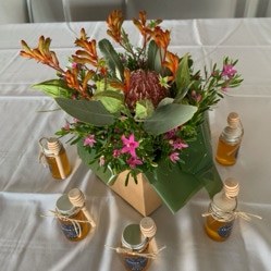 Vase with fresh delicate roses placed on table